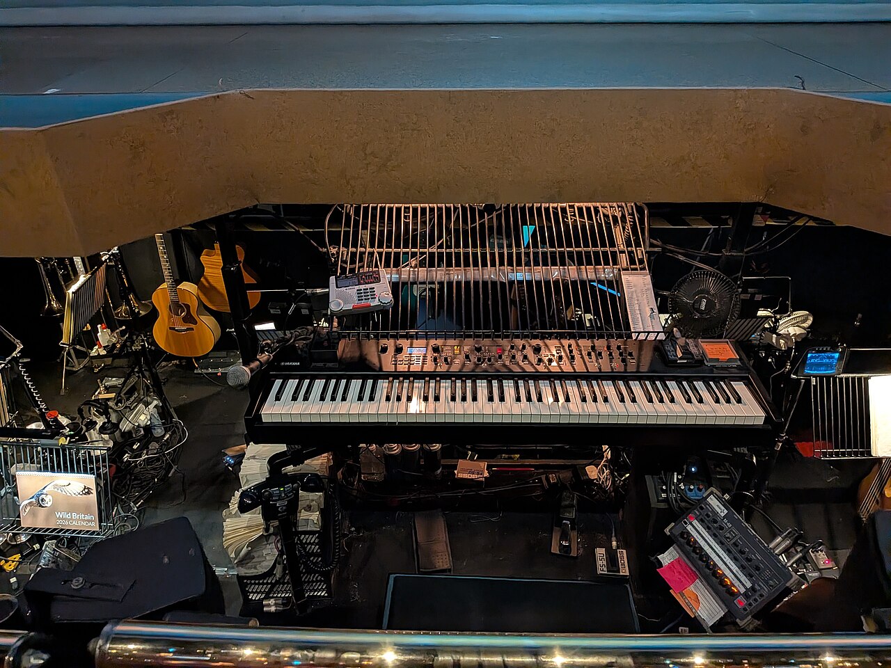 Orchestra pit with keyboards and instruments under the stage lip